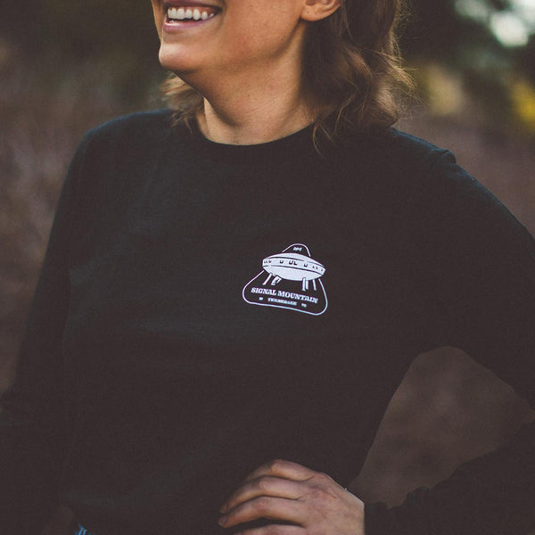Model wearing our NativeMade Signal Mountain Spaceship House long sleeve in heather black