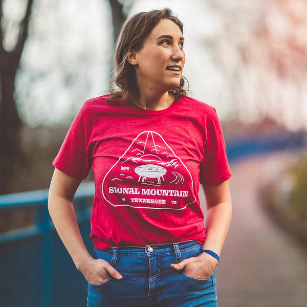 Model wearing the Signal Mountain Spaceship House Tee while walking on the Tennessee River Walk in downtown Chattanooga.